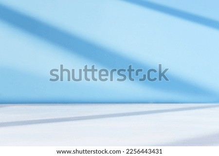 pastel blue background for product display or mock up with shadow and light.