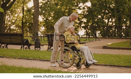 Loving senior husband supporting wife with disability, marriage harmony