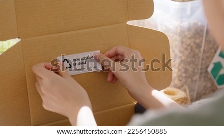Eco vendor go green packaging parcel carton box in net zero waste store asian seller retail shop. Earth care day small SME owner asia people wrap reuse brown paper pack gift reduce plastic free order. Royalty-Free Stock Photo #2256450885