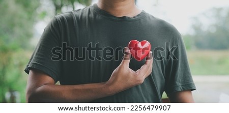 Hand holding red heart, World health day, Health care and mental health concept, Health insurance, Charity volunteer donation, CSR responsibility, World heart day, Self love Royalty-Free Stock Photo #2256479907