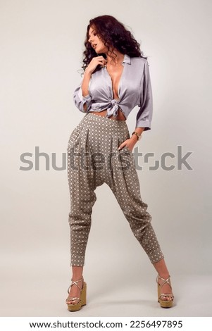 beautiful young woman fashion photo on gray background