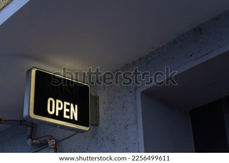 A business sign that says ‘Open’ on cafe or restaurant.