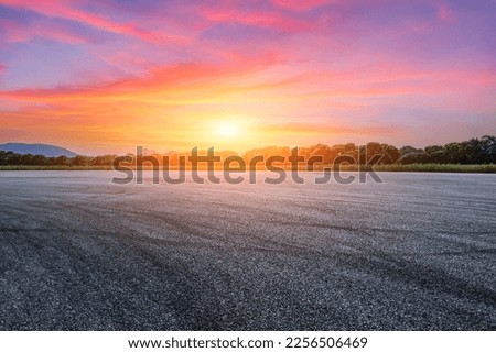 Asphalt road with sky clouds at sunset