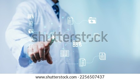 A medical worker works with an electronic database and documents.Technology and access information, database, storage, Digital link tech, big data Royalty-Free Stock Photo #2256507437