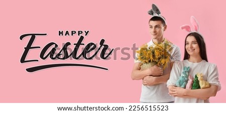 Easter banner with happy young couple in bunny ears on pink background