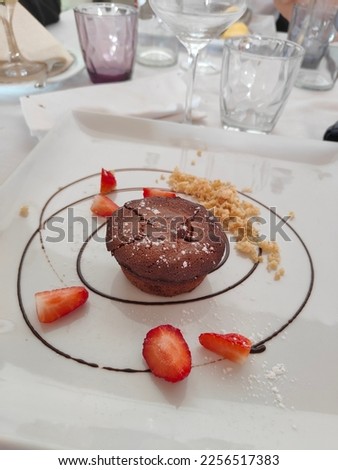 chocolate soufflé with strawberries and sugar