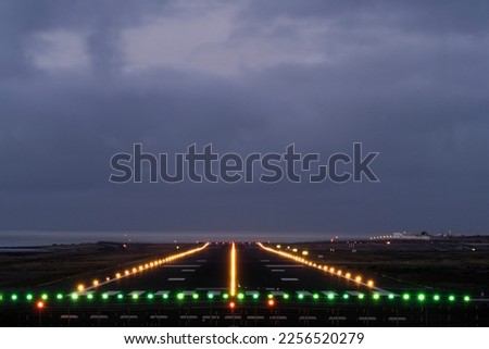 Landing lights of the island airport in the evening Royalty-Free Stock Photo #2256520279
