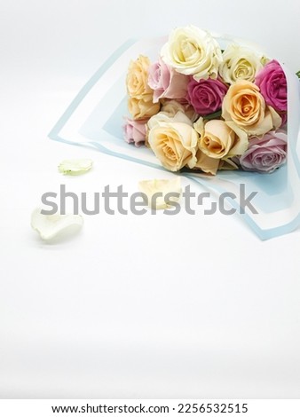 Bouquet of flowers. A composition of multi colored roses. Background for postcard, greeting card. Copy space 
