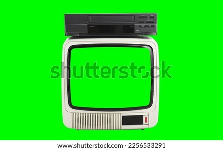 Old white vintage TV with green screen to add images and VCR 1980s, 1990s, 2000s green background.