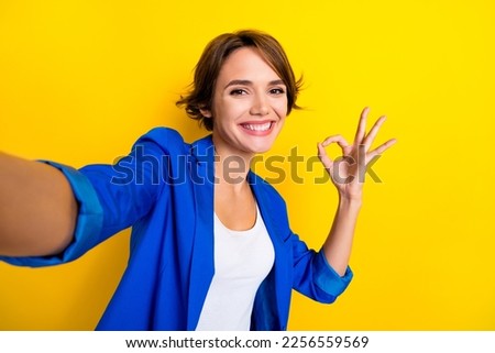 Selfie portrait of business lady executive make okay symbol advertise offer isolated shine color background