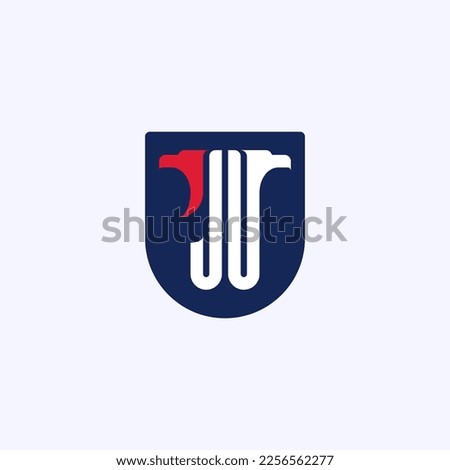 Letters J and U with the heads of an eagle or a griffin on the shield. Concise logo with monogram JU or UJ. An emblem for fans of esports or an airsoft team.