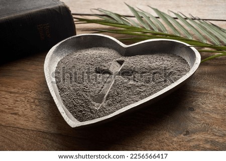 Ash wednesday, crucifix made of ash, dust as christian religion. Lent beginning Royalty-Free Stock Photo #2256566417