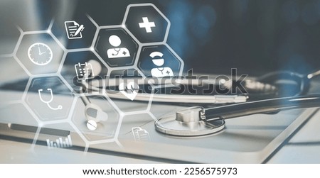Stethoscope on laptop. Health care icons on virtual screen. Healthcare, medical technology concept