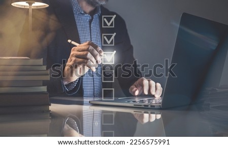 Businessman tick sign mark for assessment. Questionnaire, quality evaluation concept. Online survey Royalty-Free Stock Photo #2256575991