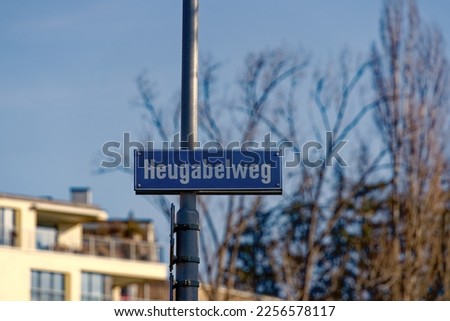 Street name sign hay fork path at City of Zürich district Seebach on a sunny winter day. Photo taken January 31st, 2023, Zurich, Switzerland.