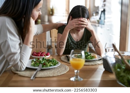 Caucasian woman support her daughter with eating disorders Royalty-Free Stock Photo #2256583303