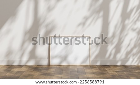 frame poster mockup standing on wooden floor with white wall and sunlight shadow