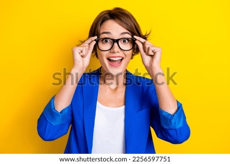 Photo of young overjoyed funny surprised businesswoman try new eyeglasses after vision ophthalmology checkup isolated on yellow color background Royalty-Free Stock Photo #2256597751