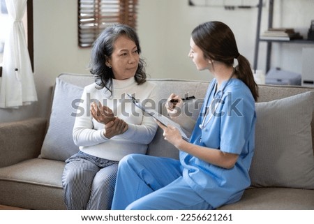 Professional Doctor and patient are discussing at clinic, Happy young female doctor provide medical care.   
