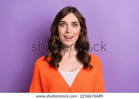 Photo of young funny crazy astonished woman curly brunette hair unexpected reaction good news proposition job isolated on violet color background