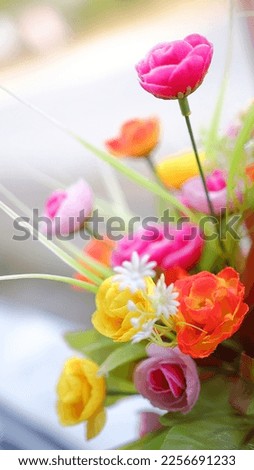 A colorful bouquet of artificial flowers blooming bright background
artificial flowers.