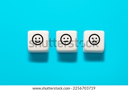 Smiley face, neutral face and sad face. Service rating and costumer satisfaction concept Royalty-Free Stock Photo #2256703719