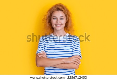 cheerful redhead woman face isolated on yellow background. face of young redhead woman