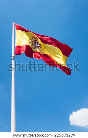 The Spanish flag with a cloud on the sky