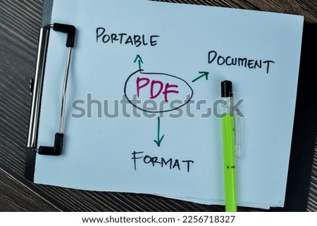 Concept of PDF - Portable Document Format write on paperwork isolated on Wooden Table.