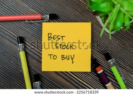 Concept of Best Stock To Buy write on sticky notes isolated on Wooden Table.