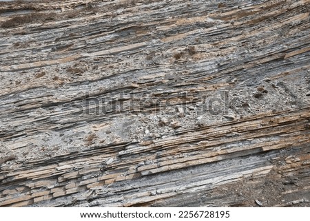 texture of rock with different rocks, several layers of rock, close-up.