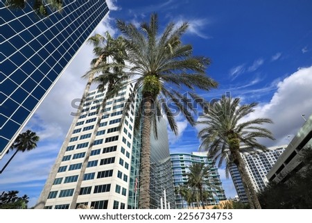 Looking up at the downtown Orlando skyline, steps away from Lake Eola. Royalty-Free Stock Photo #2256734753