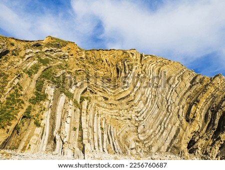 Folds result from the slow deformation of rocks. Royalty-Free Stock Photo #2256760687