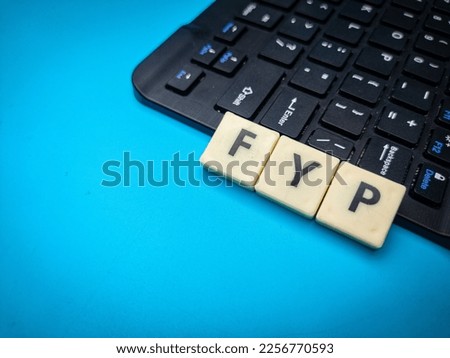 Wireless keyboard and toys word with word FYP. Business concept.