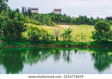 Scenic view beautiful golf course pond castle background view green lawn forest Reflection trees bush lush in water scenery valley lake country park