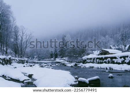 
mountain river, fog, fast river. Royalty-Free Stock Photo #2256779491