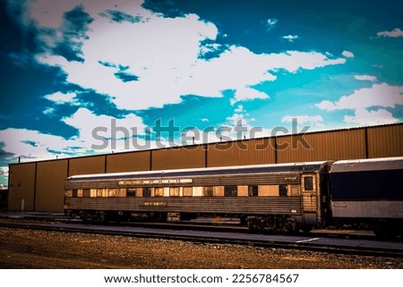 This is a photo of a retro train. This photo has a blurred background. 