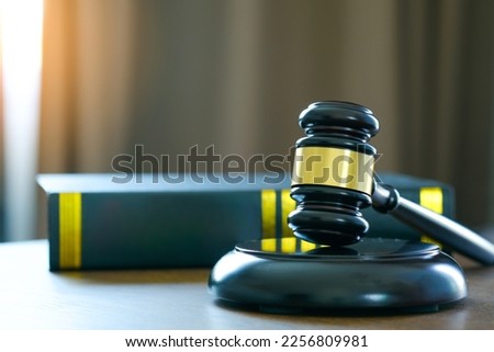 Judge hammer and law books on wooden table justice and legal concept put the law book concept and protection of the law on room book justice background