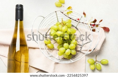 Flat-lay of white wine in glasses and corkscrews on a white background, top view, wide composition. Wine bar, winery, wine degustation concept.