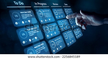 Agile software development or project management using kanban or scrum methodology boards. Process, workflow, visual organisation tools and framework technology. Finger touching virtual interface. Royalty-Free Stock Photo #2256845189
