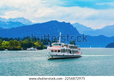 Tourist cruise boat on Lucerne Lake near Lucerne or Luzern city in central Switzerland Royalty-Free Stock Photo #2256872975