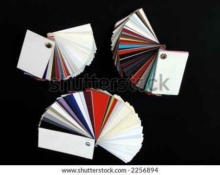 Colored samples of different papers on black background