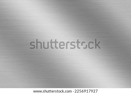 Silver metal texture of brushed stainless steel plate with the reflection of light. Royalty-Free Stock Photo #2256917927