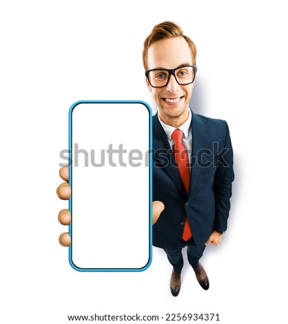 Full body image of businessman in eye glasses, black suit showing cell phone, mobile smartphone, on white background. Comic cartoon funny businessman in eyeglasses with cellphone. Expert recommending