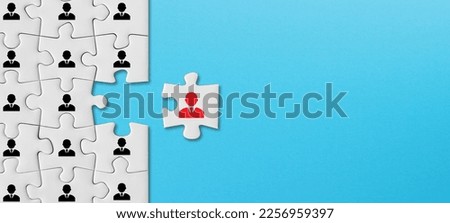Human resources and management concept, puzzle pieces with business people icon on blue background
