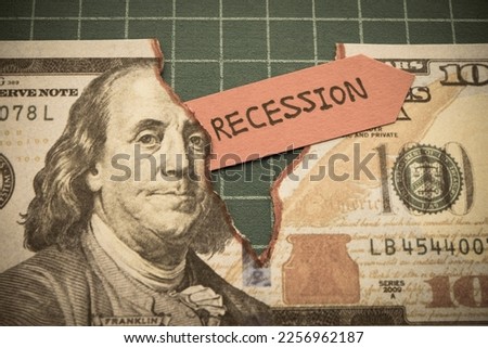 Tear off US dollar bill banknote as deep pit with word RECESSION. The Federal Reserve ( FED ) increase % interest rates to fix inflation crisis. World global economy recession and stagflation concept. Royalty-Free Stock Photo #2256962187