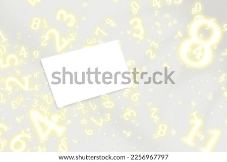 numerology, business card on a light background surrounded by numbers