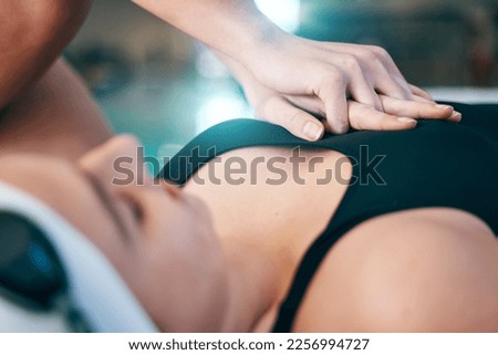 CPR, save and hands on the chest of a woman for safety training, emergency and first aid at a pool. Helping, healthcare and person resuscitating a girl after drowning while swimming for sports