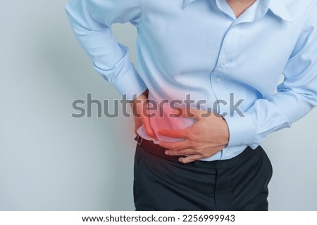man having back pain. Urinary system and Stones, Cancer, world kidney day, Chronic kidney stomach, liver pain and pancreas concept Royalty-Free Stock Photo #2256999943