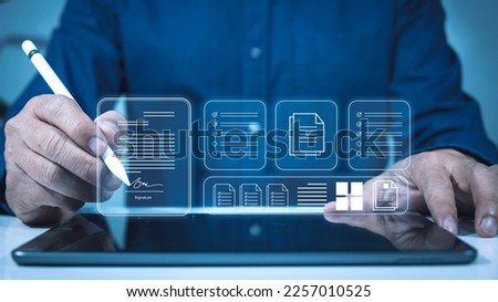 Electronic signature concept and paperless office concept. Businessman using pen to sign electronic document on digital document on virtual screen Electronic Signing Technology and Document Management